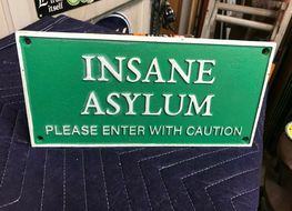 green insane asylum plaque