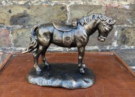 Horse figure with saddle