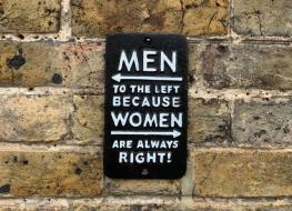 Men to the left sign