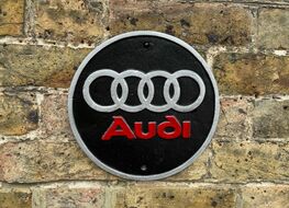 round Audi plaque