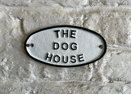 The dog house plaque