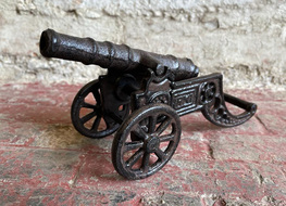 small cannon figure