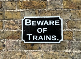 bewae of trains sign